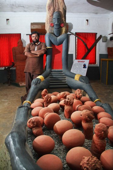 Sculptor Georgekutty at his clay art gallery and tribal museum '